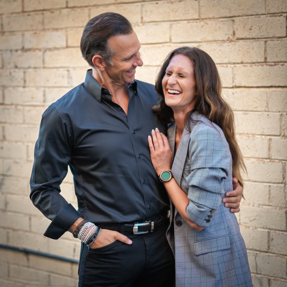 Dr. Travis Fox and Michelle Fox, laughing together